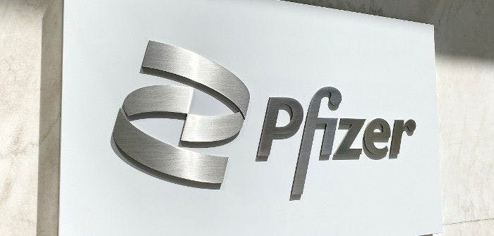 A picture of a Pfizer sign on a wall.