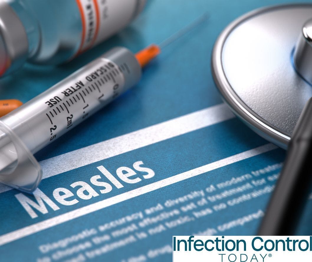 Measles—medical concept with blurred text, stethoscope, pills, and syringe on a blue background.  (Adobe Stock 104182067 by tashatuvango)