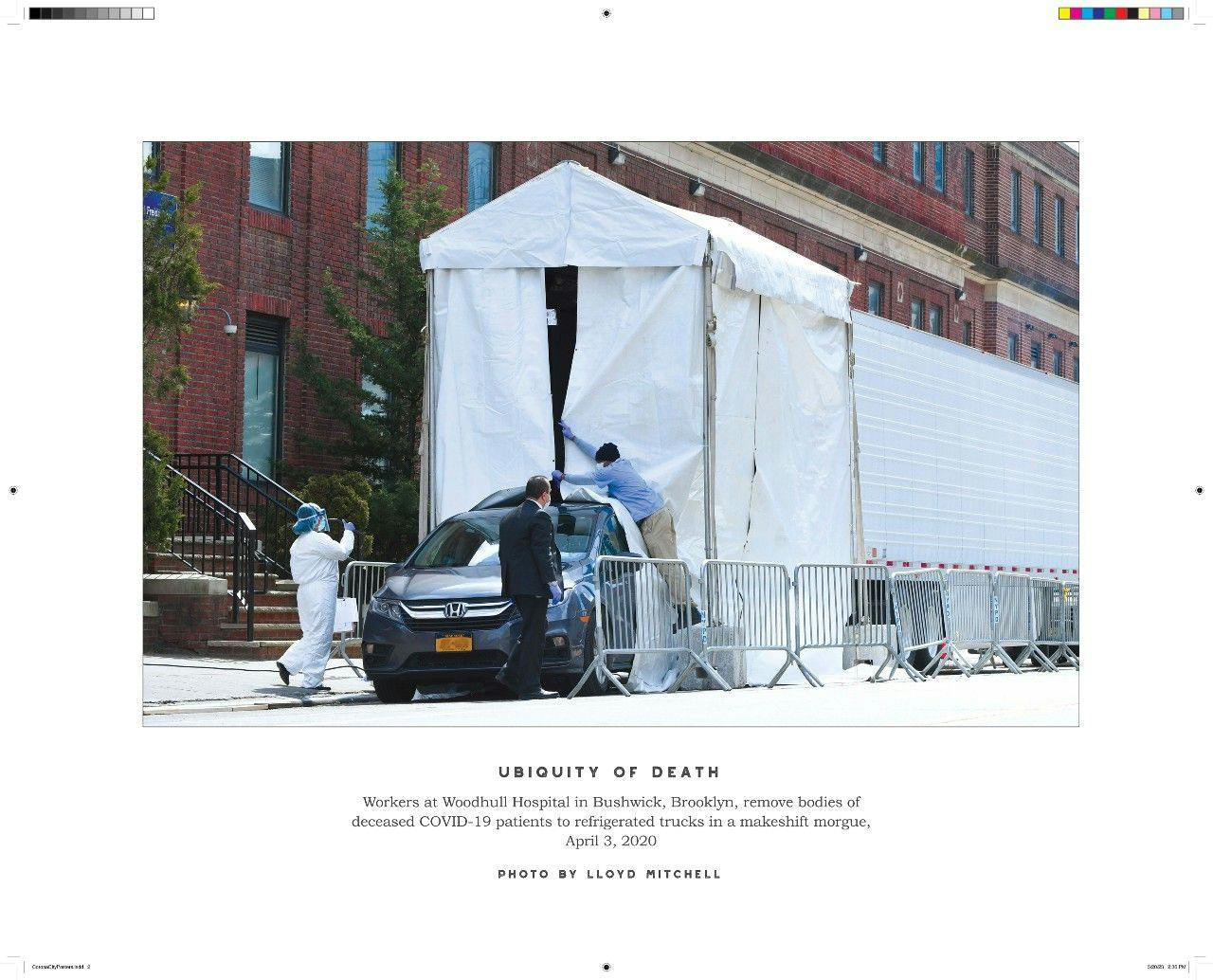 Ubiquity of Death  Workers at Woodhull Hospital in Bushwick, Brooklyn, remove bodies of deceased COVID-19 patients to refrigerated trucks in a makeshift morgue, April 3, 2020.    (Photo by Lloyd Mitchell, published in Corona City.)