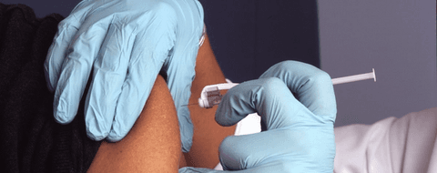 Should Vaccinated Health Care Workers Reinfected with COVID-19 be Quarantined?