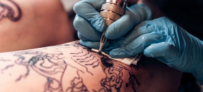 individual getting a tattoo