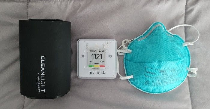 Figure 1: From left to right: portable UV-C disinfection air circulation unit, a carbon dioxide monitor, and a N95 mask.  (Photo credit: author) 