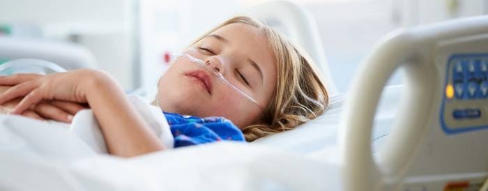 ill child in a hospital bed