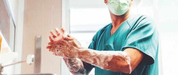 A surgeon performing hand hygiene.  