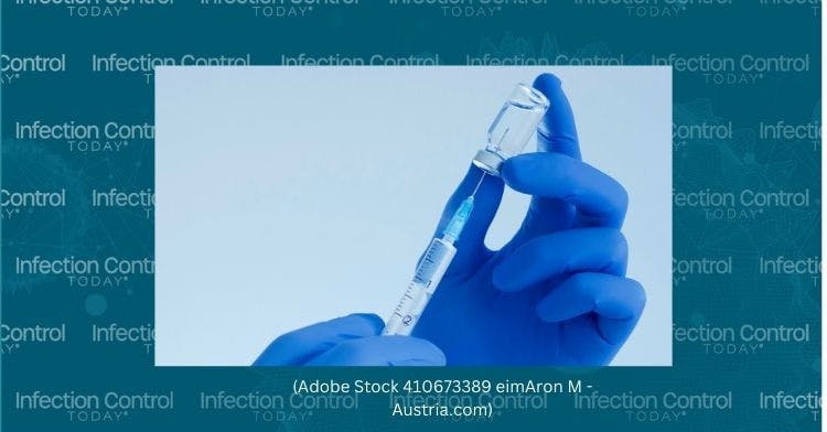 Health care worker holding a vaccine needle.  (Adobe Stock 410673389 by Aron M - Austria)
