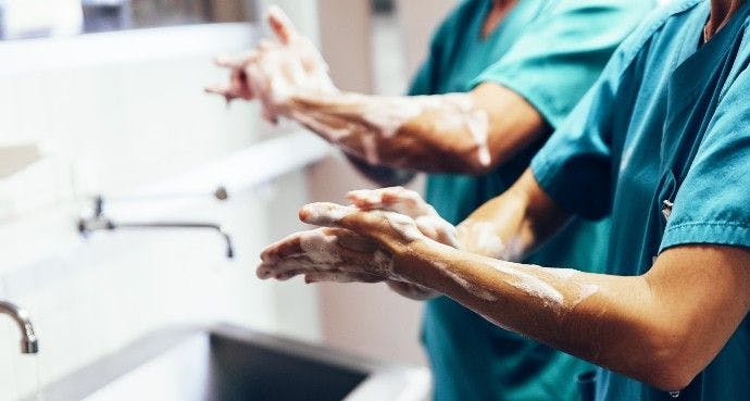 health care workers washing hands 