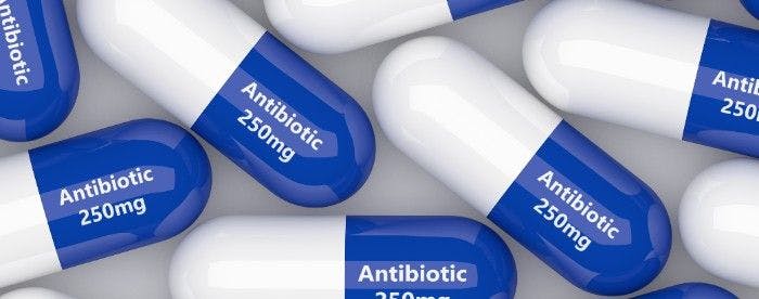 Photo of pills with "antibiotic 250 mg" written on them.   (Adobe Stock, unknown.)
