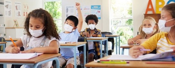 Children wearing masks for school because of the COVID-19 pandemic.