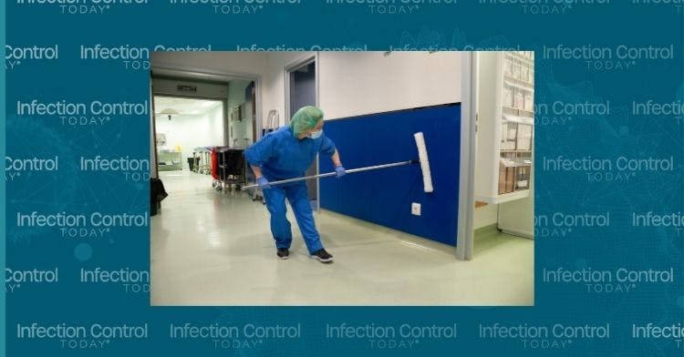 Woman from the environmental hygiene department of a hospital is cleaning the walls of the pre-operating room with a special brush.  (Adobe Stock 433775656 by aguscrespophoto) 